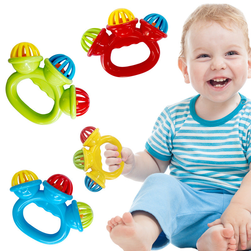 Colorful baby teething rings with a smiling baby holding one